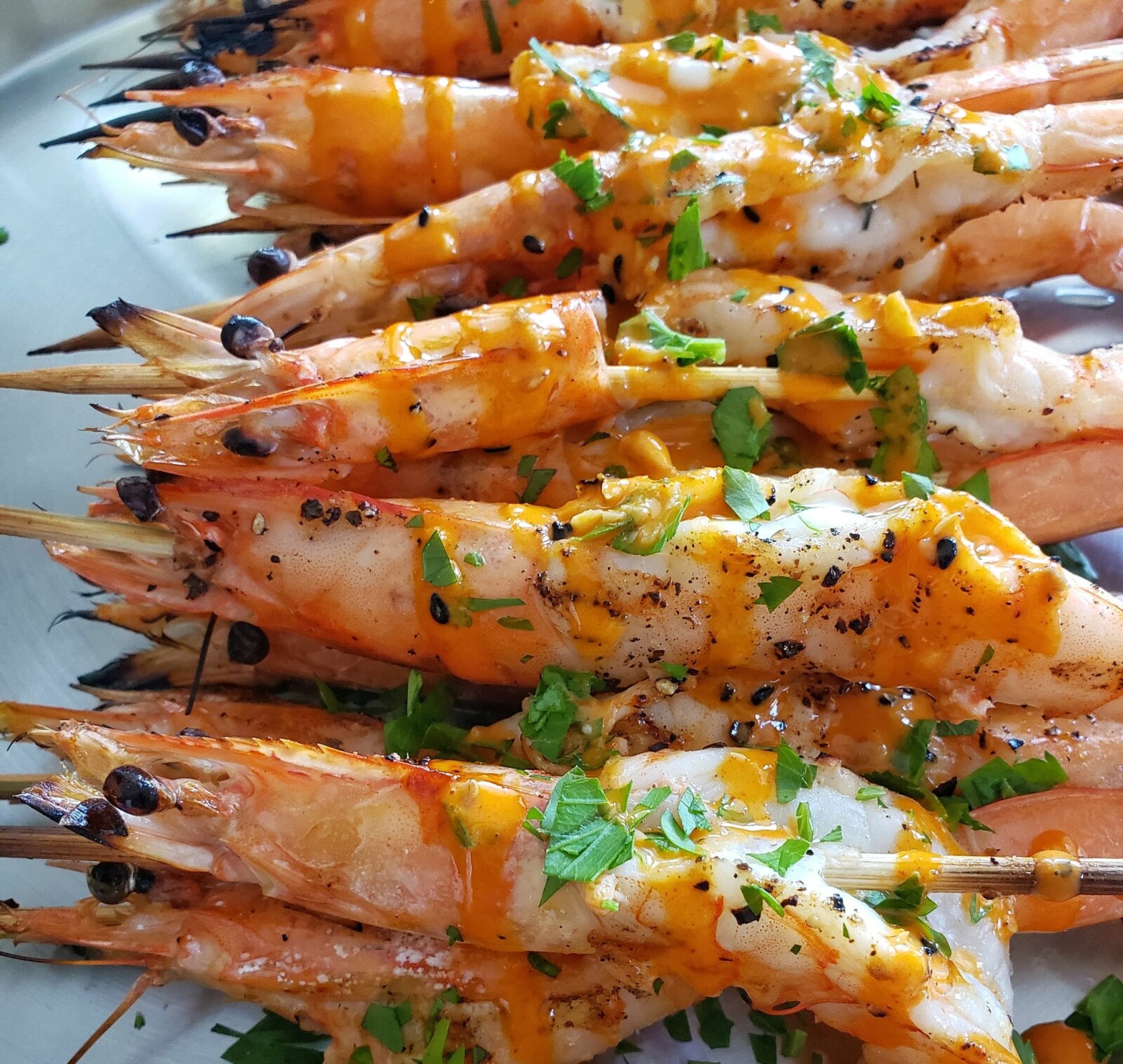 Grilled langoustines with garlic, ancho butter and chili mayo 
